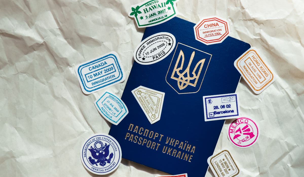 Passport-of-Ukraine-on-paper-background-with-cute-sticker-stamps-traveling-worldwide