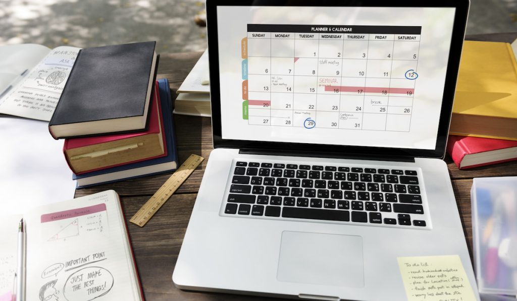 Calendar Planner Agenda in laptop and planner notebook Schedule Concept 
