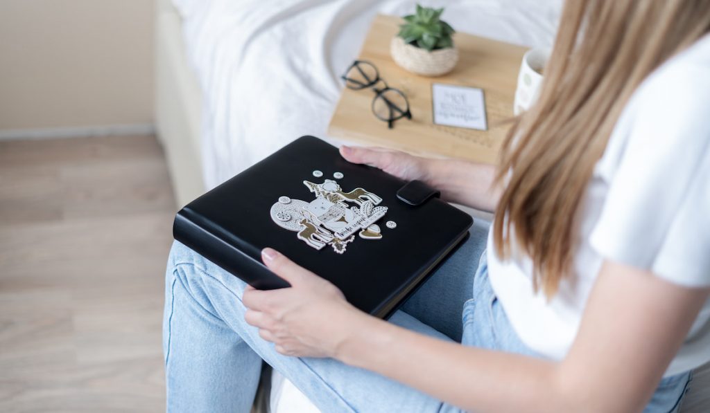 woman holding her personalized cute journal