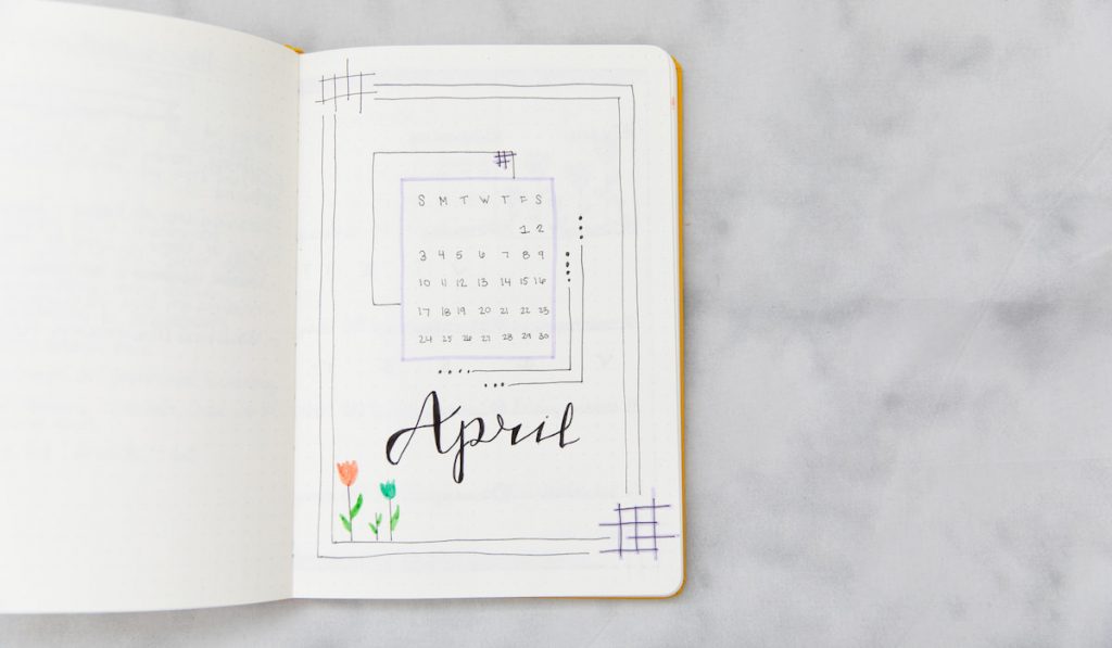 Monthly calendar on a bullet journal page
